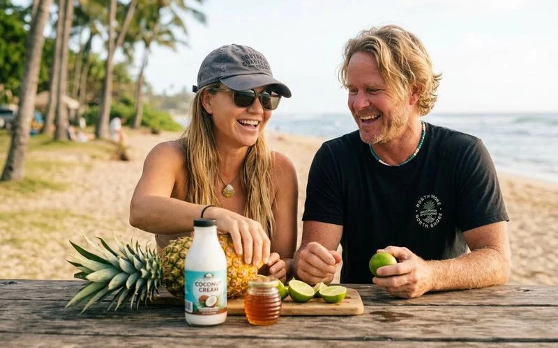 Fresh pineapple chunks, coconut cream, lime, and honey laid out for the Pineapple Tiki recipe